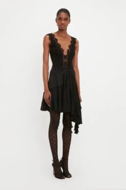 Victoria Beckham VB Monogram Tights In Black -Victoria Beckham VICTORIA BECKHAM LACE DETAIL RUFFLE MINI DRESS IN BLACK 1323WDR004839A BLACK SIDE MODEL 3 JPG