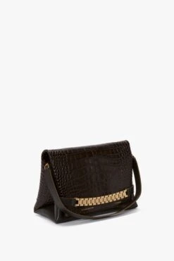 Victoria Beckham Chain Pouch With Strap In Chocolate Croc-Effect Leather 14 Victoria Beckham Chain Pouch With Strap In Chocolate Croc-Effect Leather -Victoria Beckham VictoriaBeckham ChainPouchWithStrapInBordeauxCrocLeather B423AAC005063A Side Model3 1 JPG