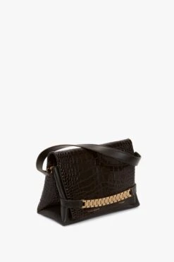 Victoria Beckham Chain Pouch With Strap In Chocolate Croc-Effect Leather 15 Victoria Beckham Chain Pouch With Strap In Chocolate Croc-Effect Leather -Victoria Beckham VictoriaBeckham ChainPouchWithStrapInBordeauxCrocLeather B423AAC005063A Side Model3 3 JPG